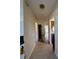 View of entryway with tile floors and access to living and kitchen areas at 1535 Nursery Rd # 107, Clearwater, FL 33756