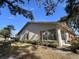 Side view of a single story home with neat landscaping at 1535 Nursery Rd # 107, Clearwater, FL 33756