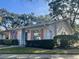 Side view of a single story home with a well maintained lawn at 1535 Nursery Rd # 107, Clearwater, FL 33756