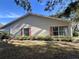 Side view of a single story home with a neat lawn at 1535 Nursery Rd # 107, Clearwater, FL 33756