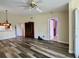 Living room with wood-look floors and built-in hutch at 1535 Nursery Rd # 107, Clearwater, FL 33756