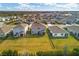 Aerial view of houses, showing backyard and community at 17209 Barnwood Pl, Bradenton, FL 34211