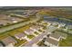 Aerial view of community with houses and ponds at 17209 Barnwood Pl, Bradenton, FL 34211