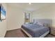 Spacious bedroom with large bed, TV, and window with a view at 17209 Barnwood Pl, Bradenton, FL 34211