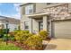 Two-story house exterior, showcasing landscaping and entryway at 17209 Barnwood Pl, Bradenton, FL 34211