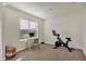 Home office or gym with Peloton bike and a desk at 17209 Barnwood Pl, Bradenton, FL 34211