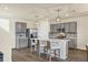 Modern kitchen with gray cabinets, white countertops, and island at 17209 Barnwood Pl, Bradenton, FL 34211