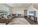 Living Room with gray sectional sofa and hardwood floors at 17209 Barnwood Pl, Bradenton, FL 34211