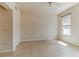 Bright bedroom featuring tile flooring, a modern ceiling fan and window with blinds at 17278 Acapulco Rd # 312, Punta Gorda, FL 33955