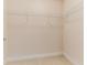 Walk-in closet features tile flooring and wire shelving at 17278 Acapulco Rd # 312, Punta Gorda, FL 33955