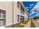 Exterior facade features covered patios and balconies with a neutral paint scheme at 17278 Acapulco Rd # 312, Punta Gorda, FL 33955