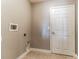 Laundry room features tile flooring, white walls, and utility connections at 17278 Acapulco Rd # 312, Punta Gorda, FL 33955