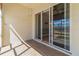 Covered patio features neutral tile flooring and sliding glass doors at 17278 Acapulco Rd # 312, Punta Gorda, FL 33955