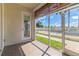 Screened-in porch with views of the fenced backyard and pool at 17278 Acapulco Rd # 312, Punta Gorda, FL 33955