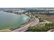 Overhead shot of the community's bridge leading to neighborhoods alongside a glistening lake at 17395 Palmetto Pass Ln, Punta Gorda, FL 33982