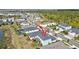 Aerial view of the home's back exterior, including the screen enclosed lanai and neighborhood at 17395 Palmetto Pass Ln, Punta Gorda, FL 33982