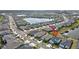 Aerial view of the homes back exterior featuring a large pond and neighborhood at 17395 Palmetto Pass Ln, Punta Gorda, FL 33982