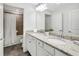 Bright bathroom featuring double sinks and granite countertops at 17395 Palmetto Pass Ln, Punta Gorda, FL 33982