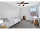 Bright bedroom featuring a ceiling fan and a window at 17395 Palmetto Pass Ln, Punta Gorda, FL 33982