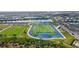 Aerial shot of a football field and track in a Primary-planned community near lakes at 17395 Palmetto Pass Ln, Punta Gorda, FL 33982