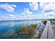 Scenic water view with boardwalk, blue skies, and serene water at 17395 Palmetto Pass Ln, Punta Gorda, FL 33982