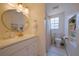 Clean bathroom, featuring a white vanity and a shower at 1752 Banyan Dr, Venice, FL 34293