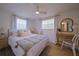 Main bedroom with a king-size bed and a workspace at 1752 Banyan Dr, Venice, FL 34293