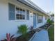 Freshly painted home with blue accents and walkway at 1752 Banyan Dr, Venice, FL 34293