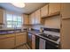 Kitchen with stainless steel appliances and a window at 1752 Banyan Dr, Venice, FL 34293