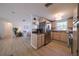 Kitchen with stainless steel appliances and light wood cabinets at 1752 Banyan Dr, Venice, FL 34293