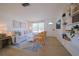 Bright living room with white sofa and built-in shelves at 1752 Banyan Dr, Venice, FL 34293