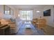 Living room with white sofa and large window at 1752 Banyan Dr, Venice, FL 34293