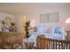 Living room featuring a white couch and wicker chairs at 1752 Banyan Dr, Venice, FL 34293