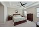 Spacious bedroom with a wooden sleigh bed, nightstands, and dresser at 17723 Gulf Ranch Pl, Lakewood Ranch, FL 34211