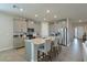 Modern kitchen with gray cabinets, quartz countertops and island at 17723 Gulf Ranch Pl, Lakewood Ranch, FL 34211