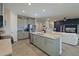 Modern kitchen with gray cabinets, quartz countertops, and island at 17723 Gulf Ranch Pl, Lakewood Ranch, FL 34211