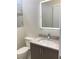 Modern bathroom with a floating vanity and a lighted mirror at 2110 Michele Dr, Sarasota, FL 34231