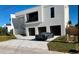 Modern home with three-car garage and paved driveway at 2110 Michele Dr, Sarasota, FL 34231