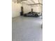 Finished garage with epoxy flooring and ample space at 2110 Michele Dr, Sarasota, FL 34231