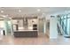 Contemporary kitchen with island, stainless steel appliances, and white cabinets at 2110 Michele Dr, Sarasota, FL 34231