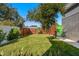 Private backyard with a grassy lawn and wooden fence at 2254 Hawthorne St, Sarasota, FL 34239