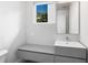 Small bathroom with floating vanity and modern fixtures at 2254 Hawthorne St, Sarasota, FL 34239