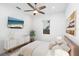 Bright bedroom with TV, built-in cabinet, and comfortable bed at 2254 Hawthorne St, Sarasota, FL 34239