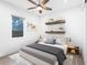 Serene bedroom with floating shelves, neutral tones, and ceiling fan at 2254 Hawthorne St, Sarasota, FL 34239