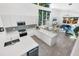 Open concept kitchen with island, white cabinets, and geometric backsplash at 2254 Hawthorne St, Sarasota, FL 34239