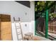 Private outdoor shower with ladder and stool near a bamboo screen at 2254 Hawthorne St, Sarasota, FL 34239