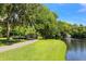 Metal footbridge over tranquil pond in a park setting at 2254 Hawthorne St, Sarasota, FL 34239