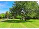 Scenic pond with fountain in a lush green park at 2254 Hawthorne St, Sarasota, FL 34239