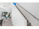 Modern staircase with metal railing leading to upper level at 2254 Hawthorne St, Sarasota, FL 34239