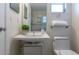 Clean and modern bathroom with a floating sink, sleek fixtures, and a neatly arranged towel at 2321 Terry Ln, Sarasota, FL 34231